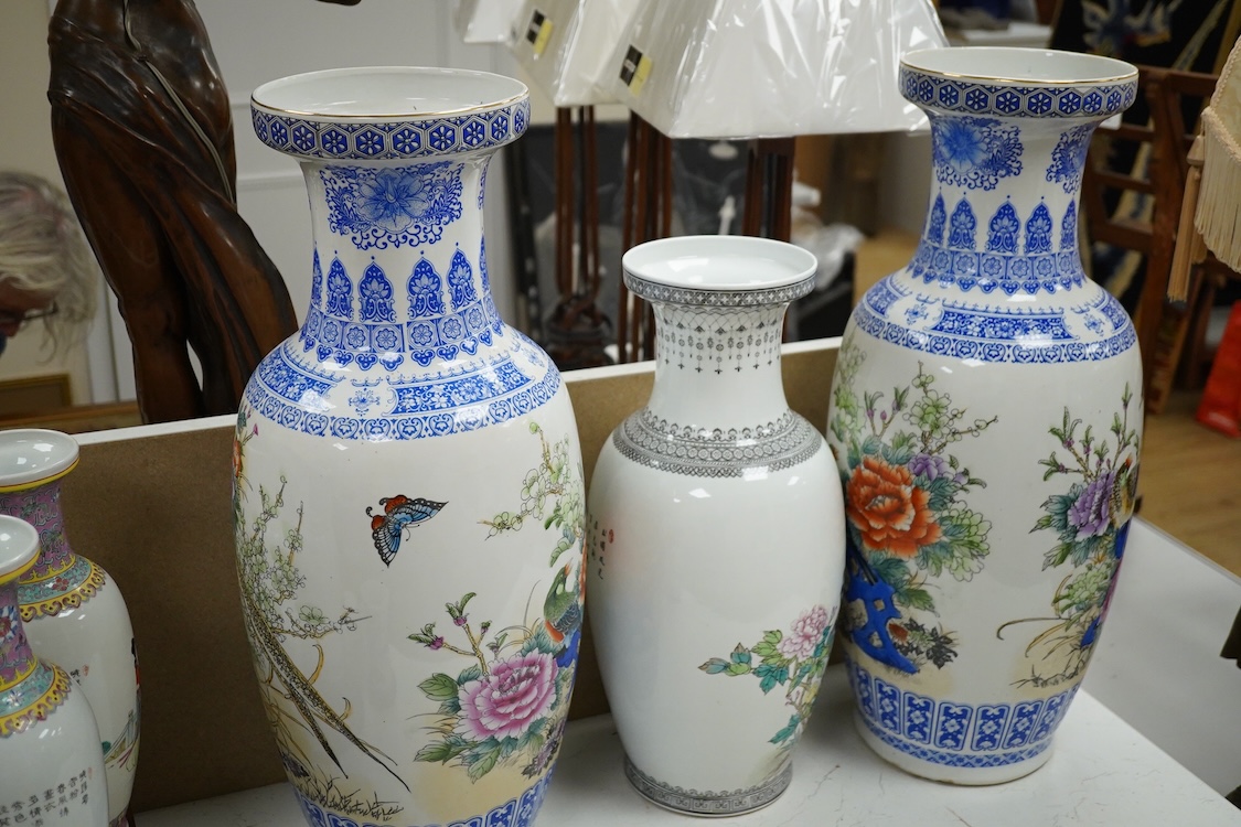 A large pair of Chinese polychrome vases, 60cm high, a pair of famille rose vases, a blue and white brushpot and two other vases (7).